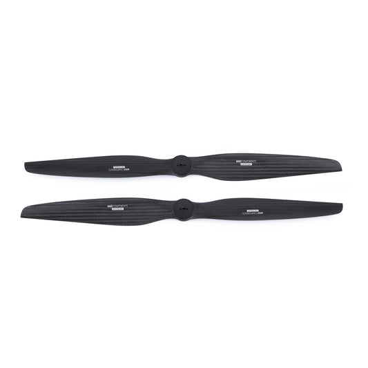 Pair of MAD FLUXER VTOL carbon fiber propellers in black with centered mounting hub and printed markings