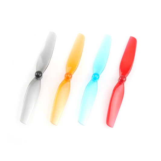 HQ Micro Prop 65mm propeller color options shown in four translucent finishes: gray, orange, blue, red