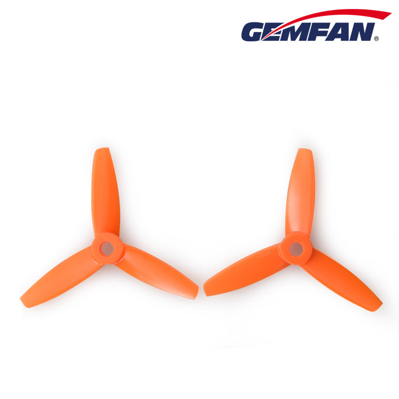 Pair of orange 3-blade bullnose propellers shown side by side