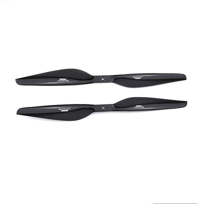 Pair of glossy carbon fiber drone propellers with central mounting holes, black 2-blade design