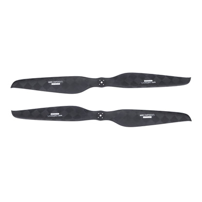 Pair of MAD Components carbon fiber drone propeller blades with center mounting holes and black weave finish