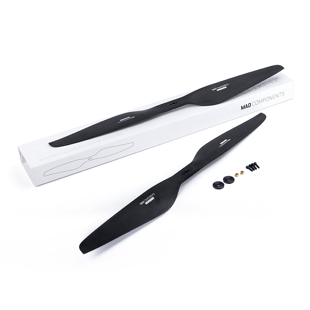 MAD FLUXER Pro 20x6.0 Carbon Fiber Propeller, MAD FLUXER Pro carbon fiber propeller set with two black blades, mounting hardware, and MAD Components box