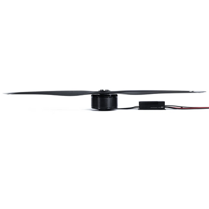 Drone motor with large 64x20 propeller and inline ESC module connected by power wires, side view