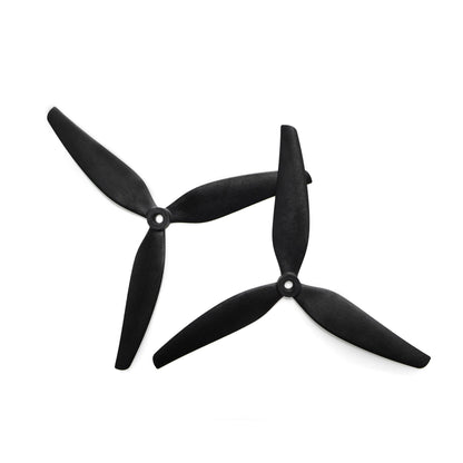 Black tri-blade drone propellers, pair shown with center hubs