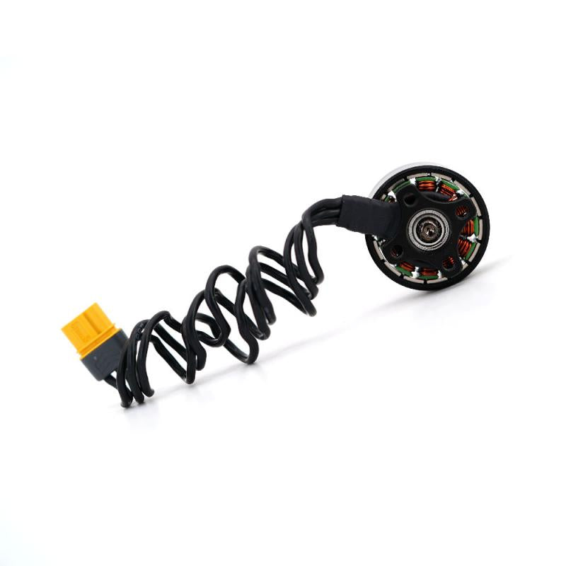 TBS Chupito EX2207 motor rear view showing stator windings, bearing, cable, and yellow connector