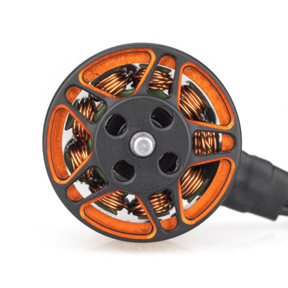 Top view of motor bell with orange spokes and visible copper windings