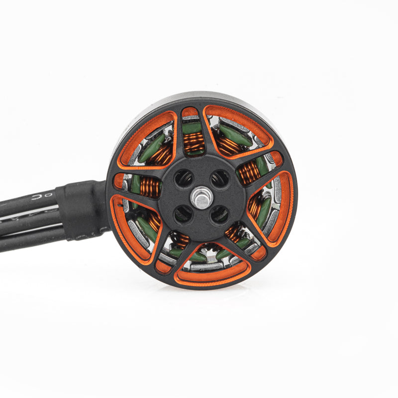 Top view of motor bell showing orange spokes, center mounting holes, and attached three-phase wires