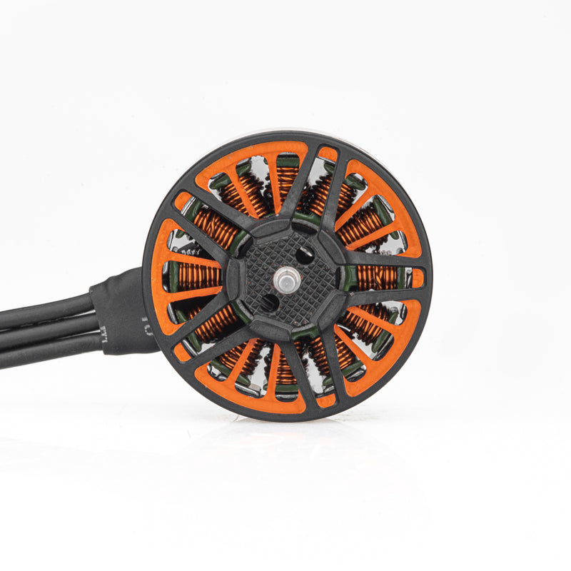 Bottom view showing orange stator coils and three motor wires on SPARK 2005 brushless motor