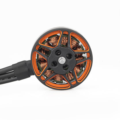 Top view of motor bell showing orange cutouts, mounting holes, and copper windings