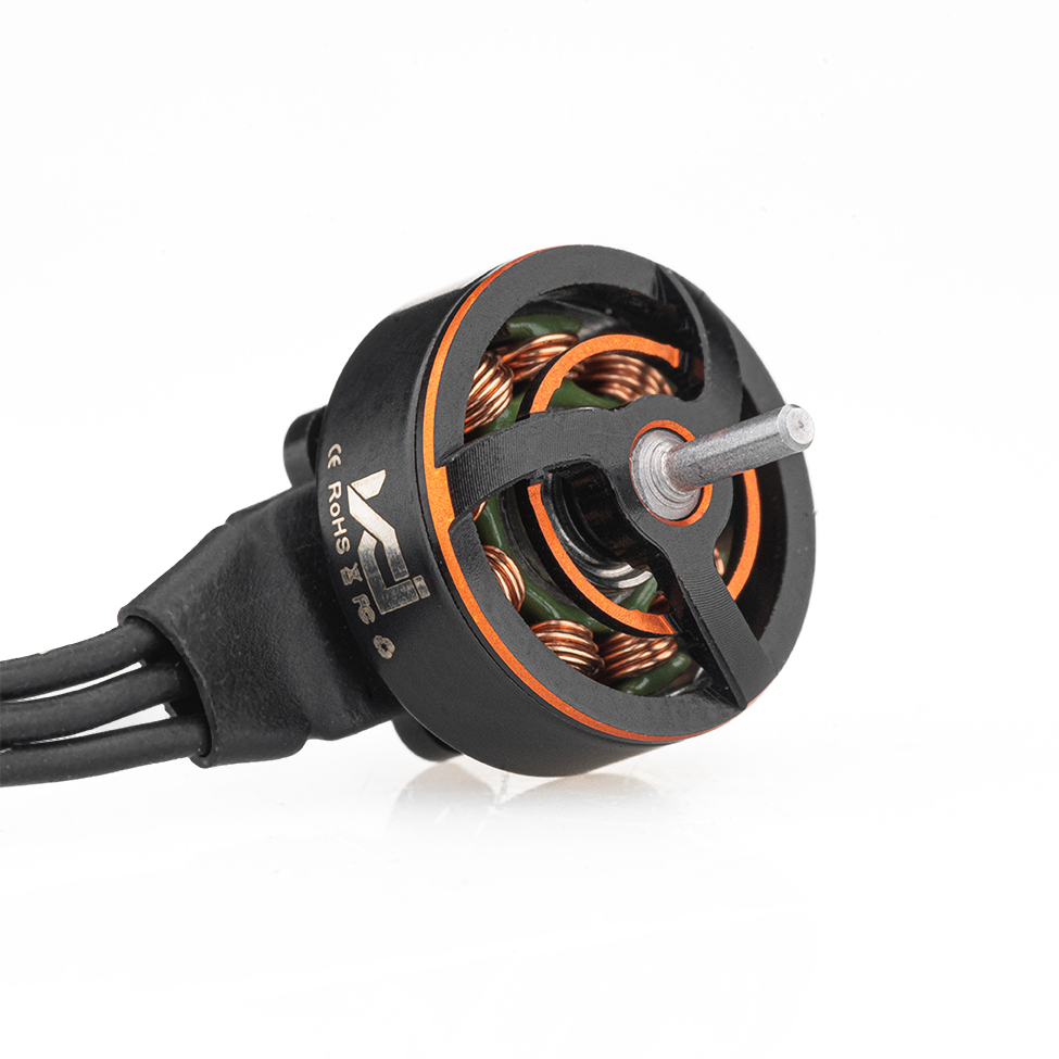 Angled view of VCI SPARK 0802 motor showing exposed copper windings, shaft, and three power wires