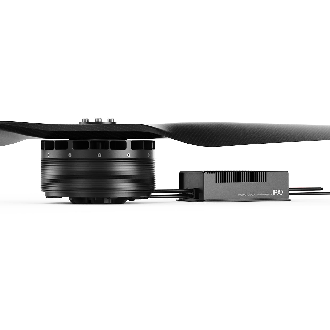 MAD AM75 motor with carbon propeller and SineSic ESC module labeled IPX7, side view