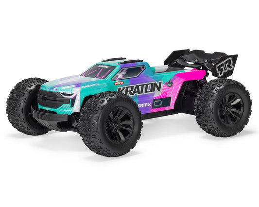 ARRMA Mini Kraton 1/16 4x4 RC monster truck in teal and pink with knobby tires and rear wing