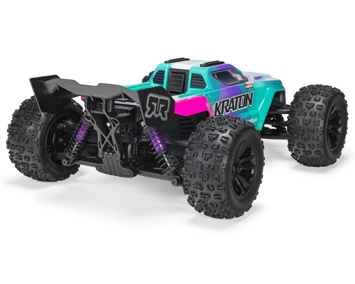 ARRMA Mini Kraton 1/16 RC monster truck in teal and pink with rear wing, purple shocks, and knobby tires