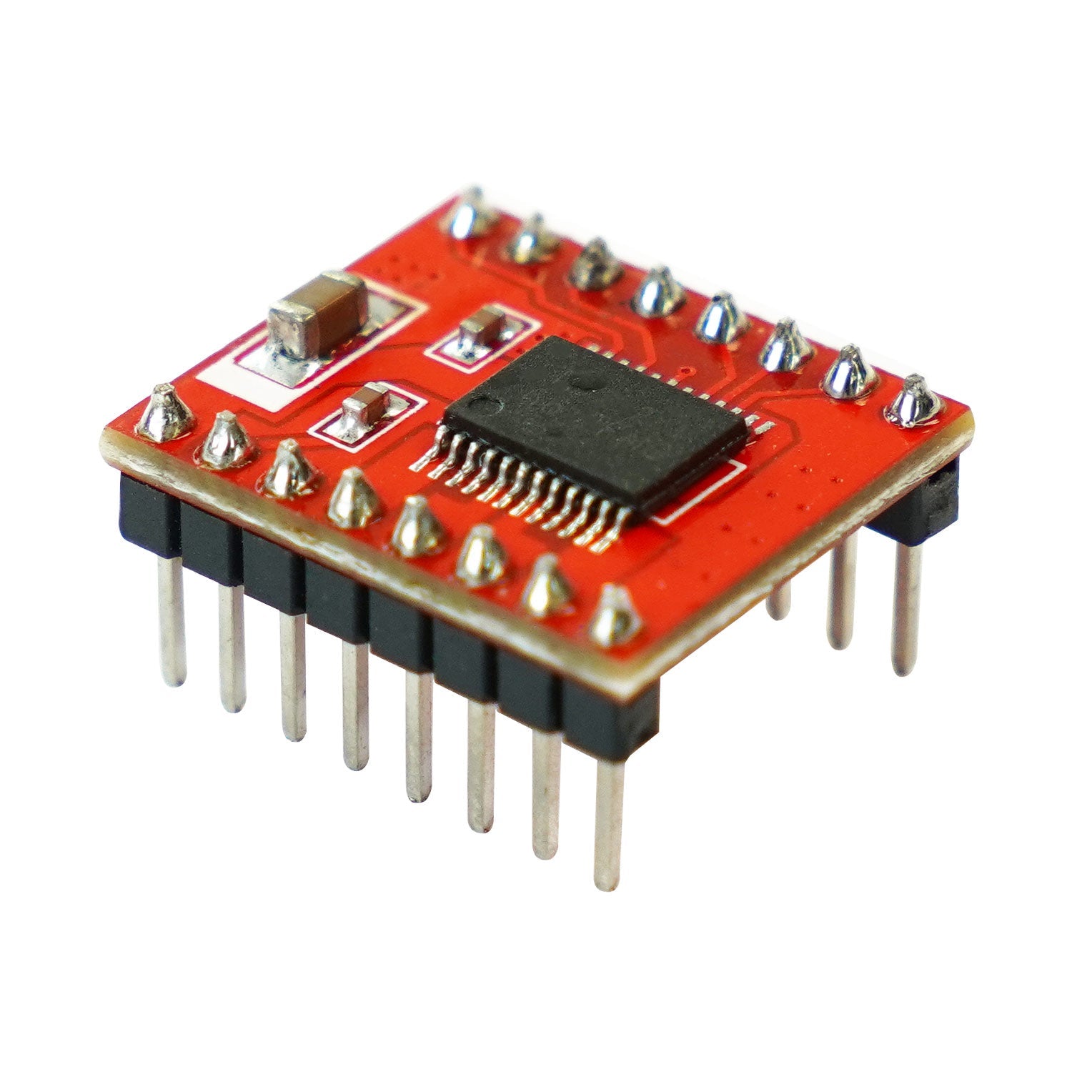 Red TB6612FNG driver breakout board angled close-up showing SMD chip and header pins