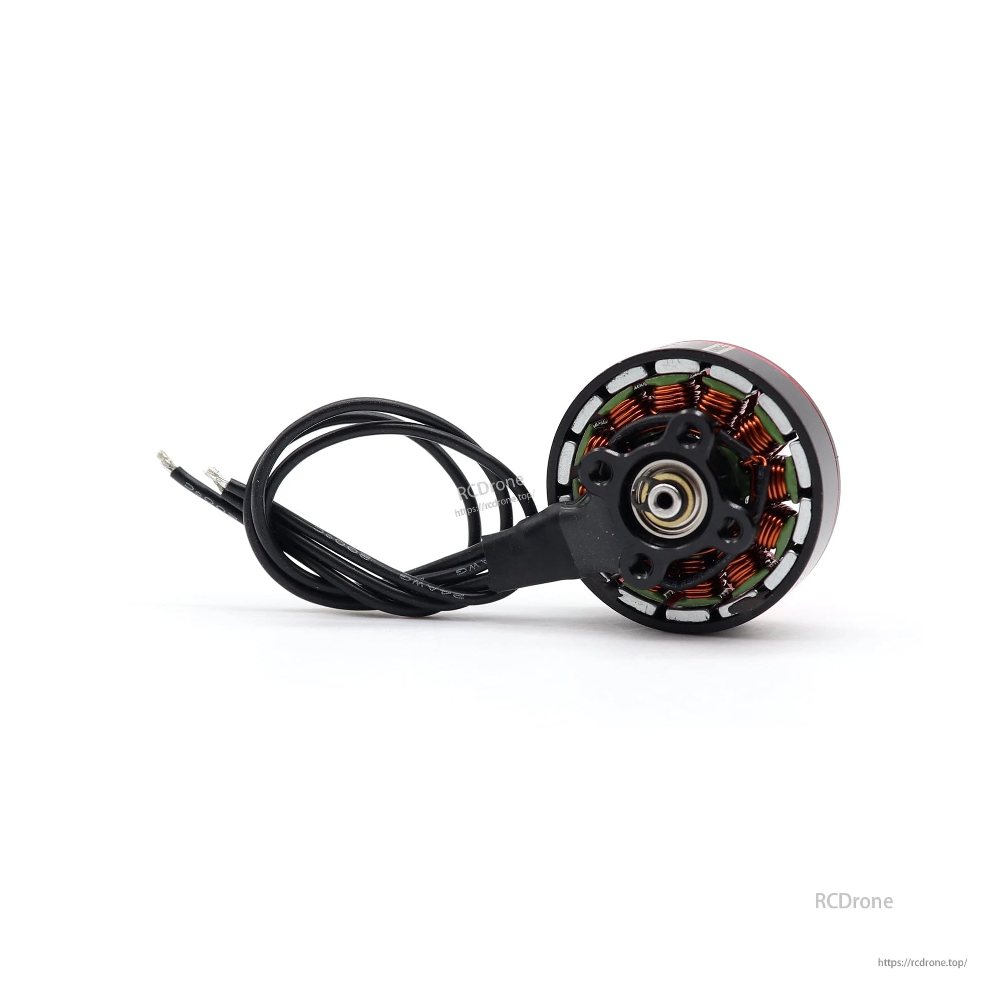 Bottom view of motor base showing copper windings, mounting hub, and attached lead wires