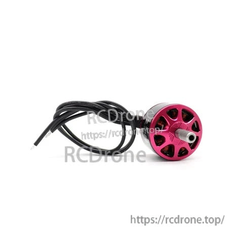 Front face of the red ATOMRC brushless motor with vented end bell, threaded shaft, and lead wires coiled beside it