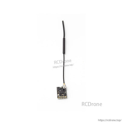 FPV receiver module connected to antenna cable, overhead view on white background
