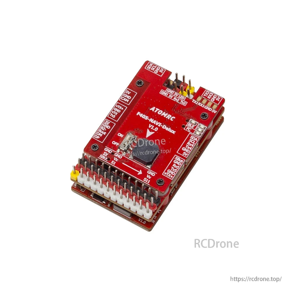 Top view of ATOMRC F405 NAVI Delux V1.1 board with labeled pads, arrow marking, and dual pin headers