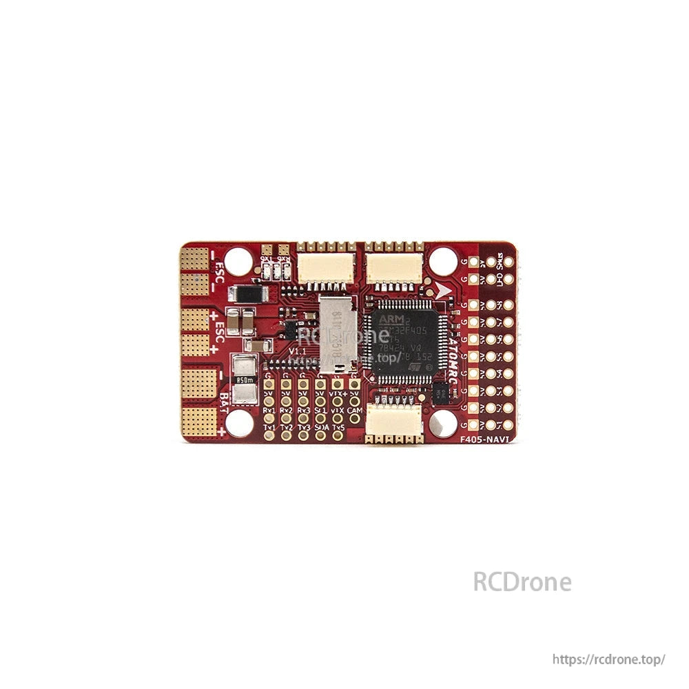 Close-up of flight controller PCB top side with chips, solder pads, and connector ports