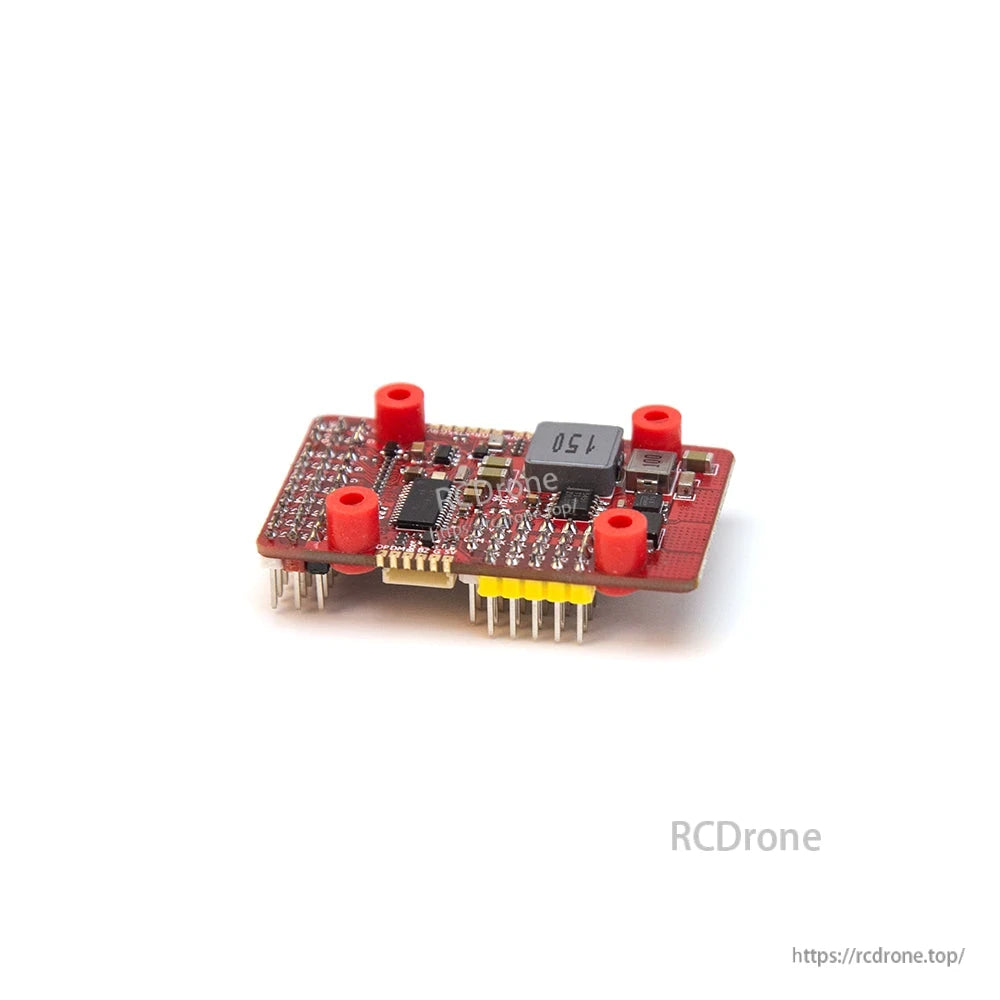 Angled side view of flight controller board with installed pin headers and red standoffs