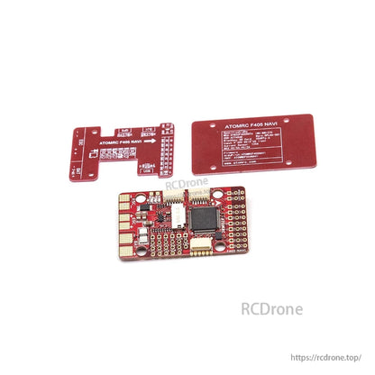 Flight controller board with two red mounting plates, showing ATOMRC F405 NAVI label and pinout text