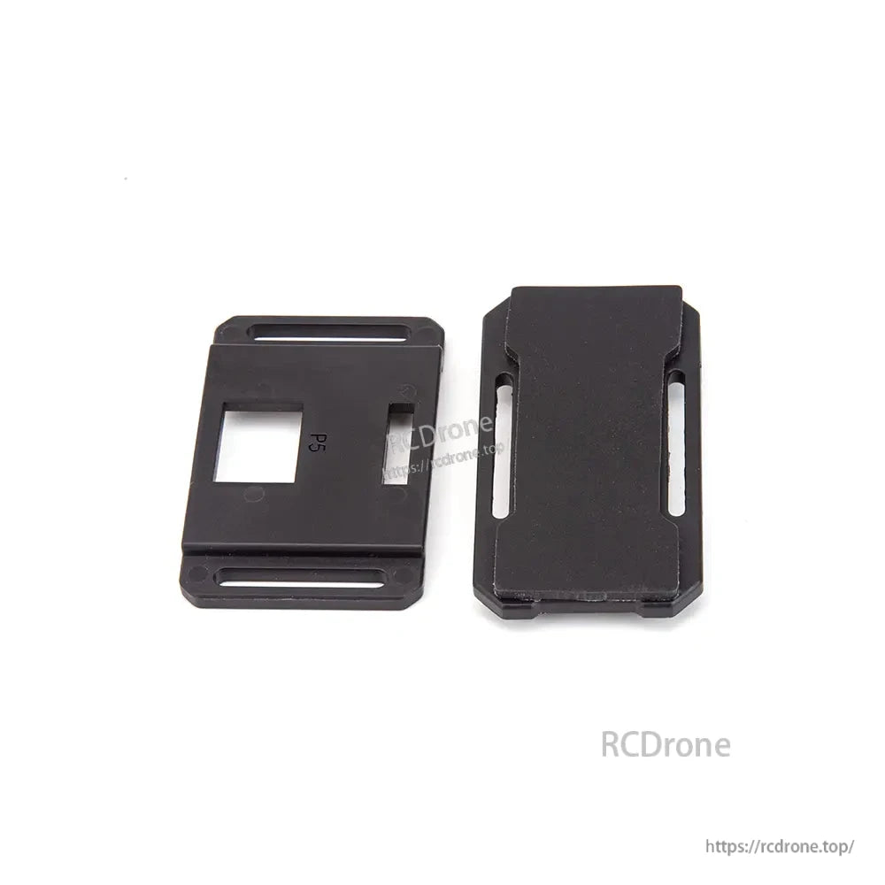 Two black mounting plates with slots and cutouts for RC aircraft accessory installation
