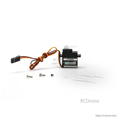 Servo shown with three mounting screws and two white servo horns laid out on white background