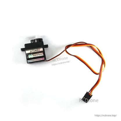Side profile of servo housing with output shaft and 3-wire lead, connector visible