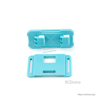 Two blue plastic replacement brackets with clip tabs and slotted mounting holes for ATOMRC Swordfish fixed wing