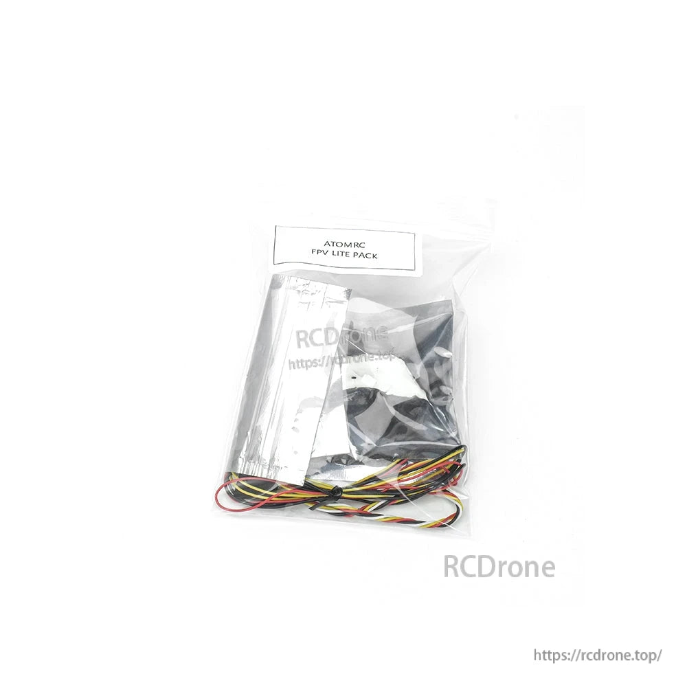 Sealed ATOMRC FPV Lite Pack bag with included components and multicolor wiring harness visible