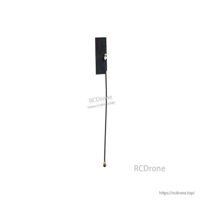 Rectangular adhesive patch antenna with coax lead and gold threaded RF connector, alternate view