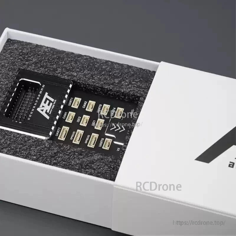 AeroEggTech AET-U7 STM32H753 flight controller features triple IMU, dual barometer, IST-8310 sensor, and foam packaging for industrial drones.