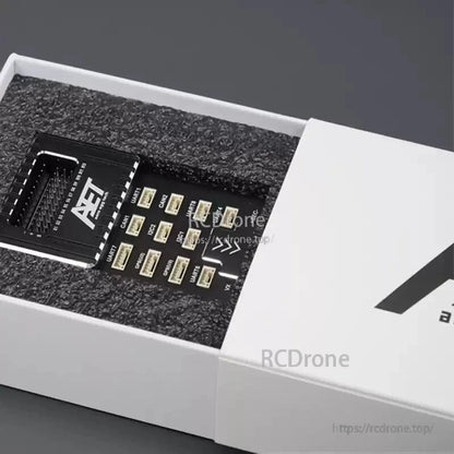 AeroEggTech AET-U7 STM32H753 flight controller features triple IMU, dual barometer, IST-8310 sensor, and foam packaging for industrial drones.