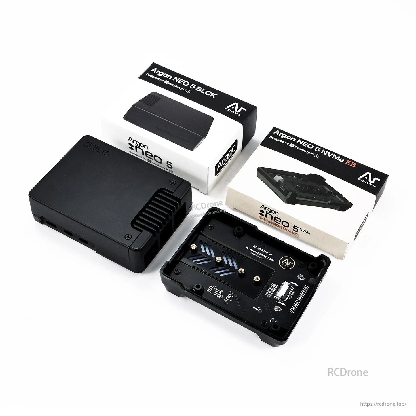 Argon NEO 5 case and NVMe expansion board with two retail boxes shown on white background