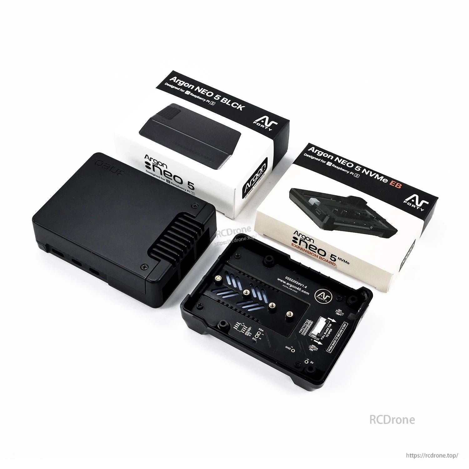 Argon NEO 5 case and NVMe expansion board with two retail boxes shown on white background