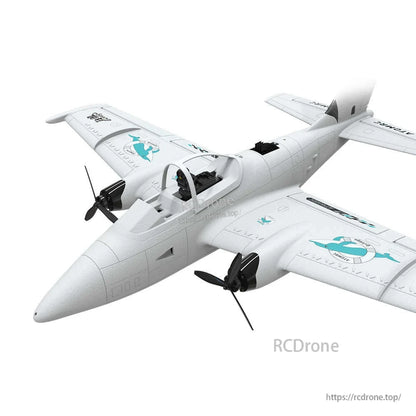 Close front three-quarter view of RC plane nose and FPV cockpit canopy with twin propellers
