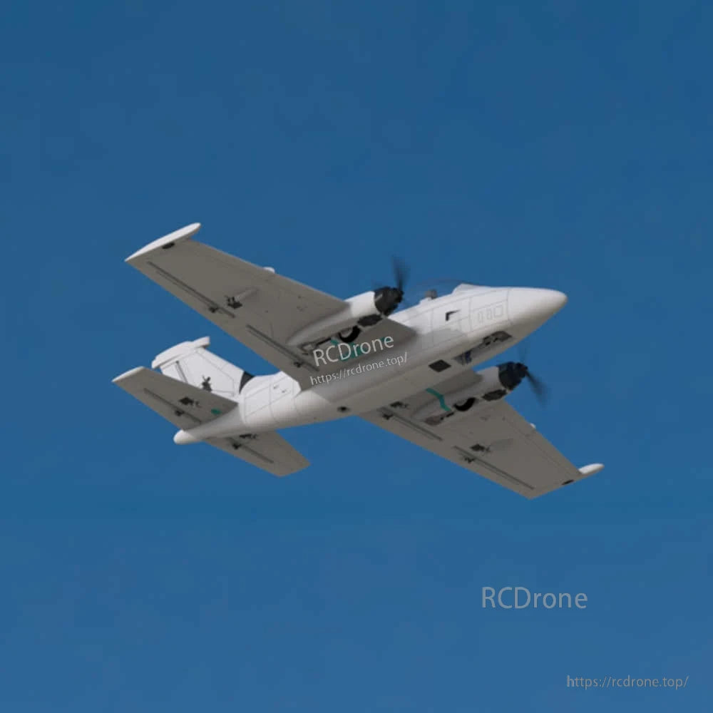 Beluga twin-engine fixed-wing RC plane in flight, underside view against blue sky