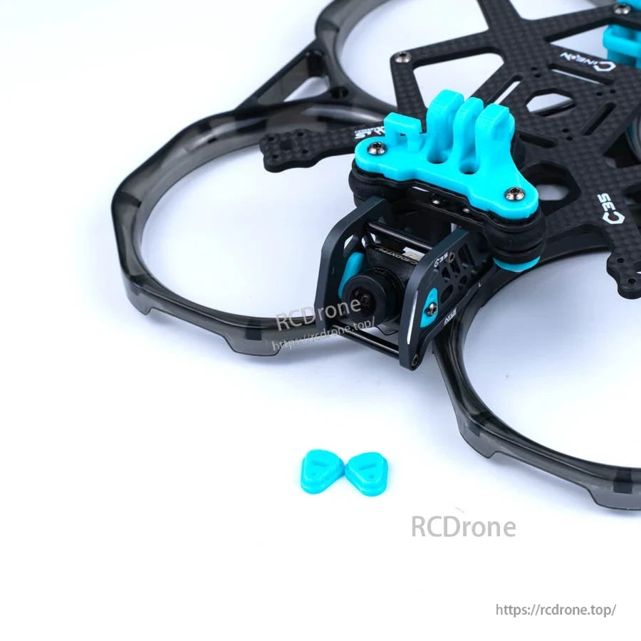 Axisflying C30/C35 V2 aluminum camera plates installed on a cinewhoop drone frame with blue TPU mount