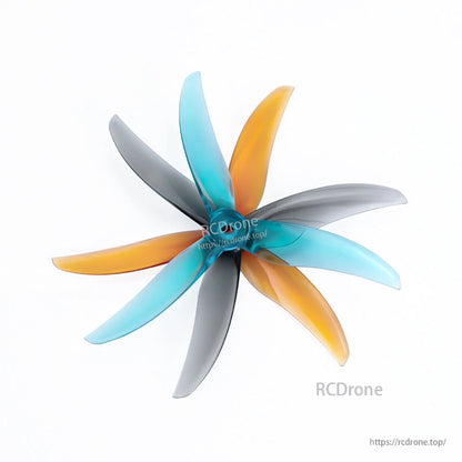 Axisflying x BlackBird V3 BB39 freestyle drone propellers with three-blade design in blue, orange, and gray