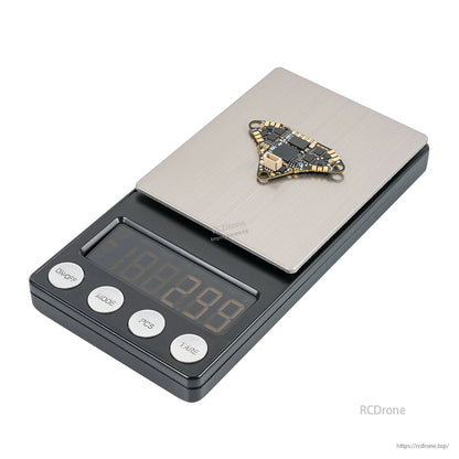 BETAFPV Air Brushless Flight Controller on digital scale for size and weight reference