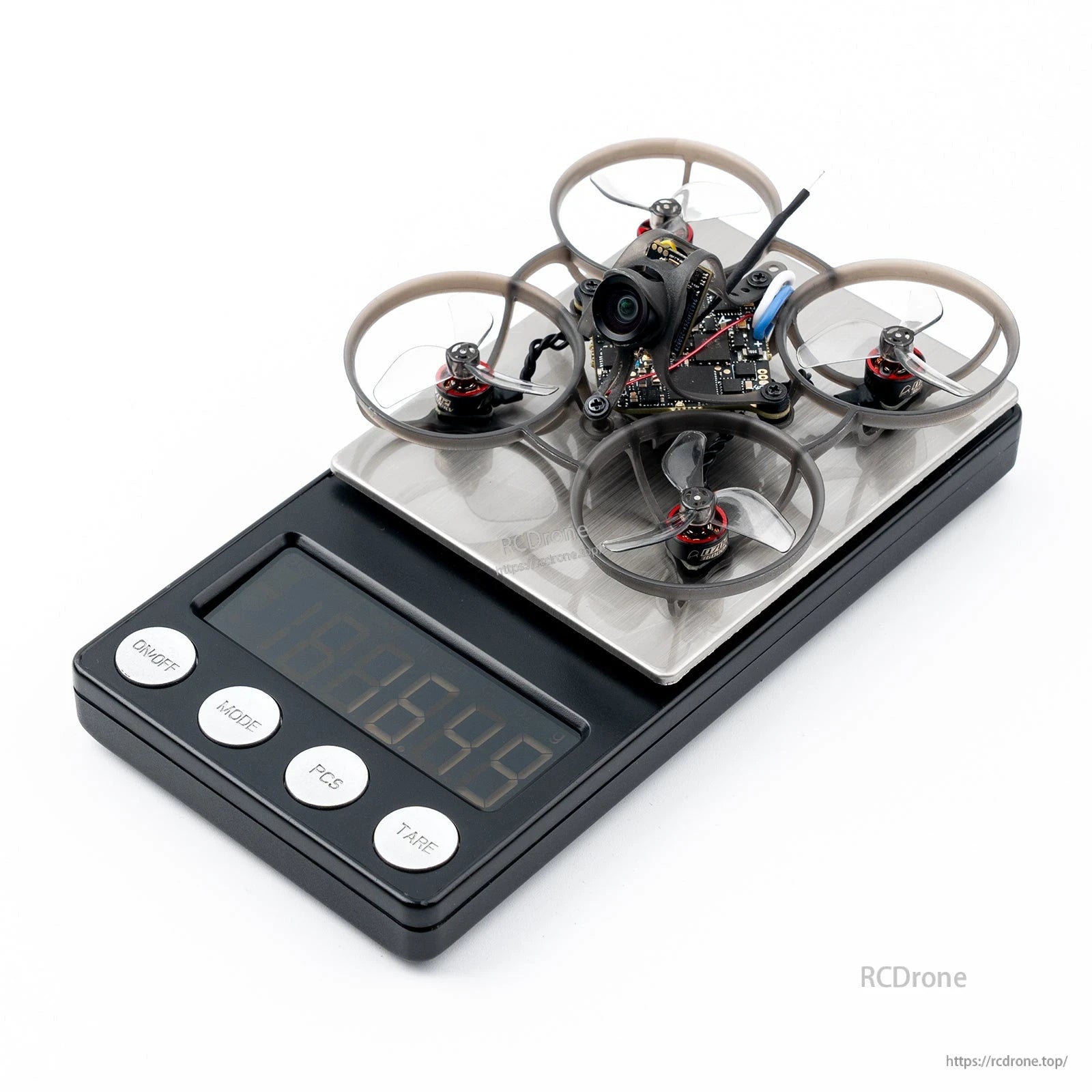 BETAFPV micro ducted FPV drone with FPV camera sitting on a digital scale for weight measurement