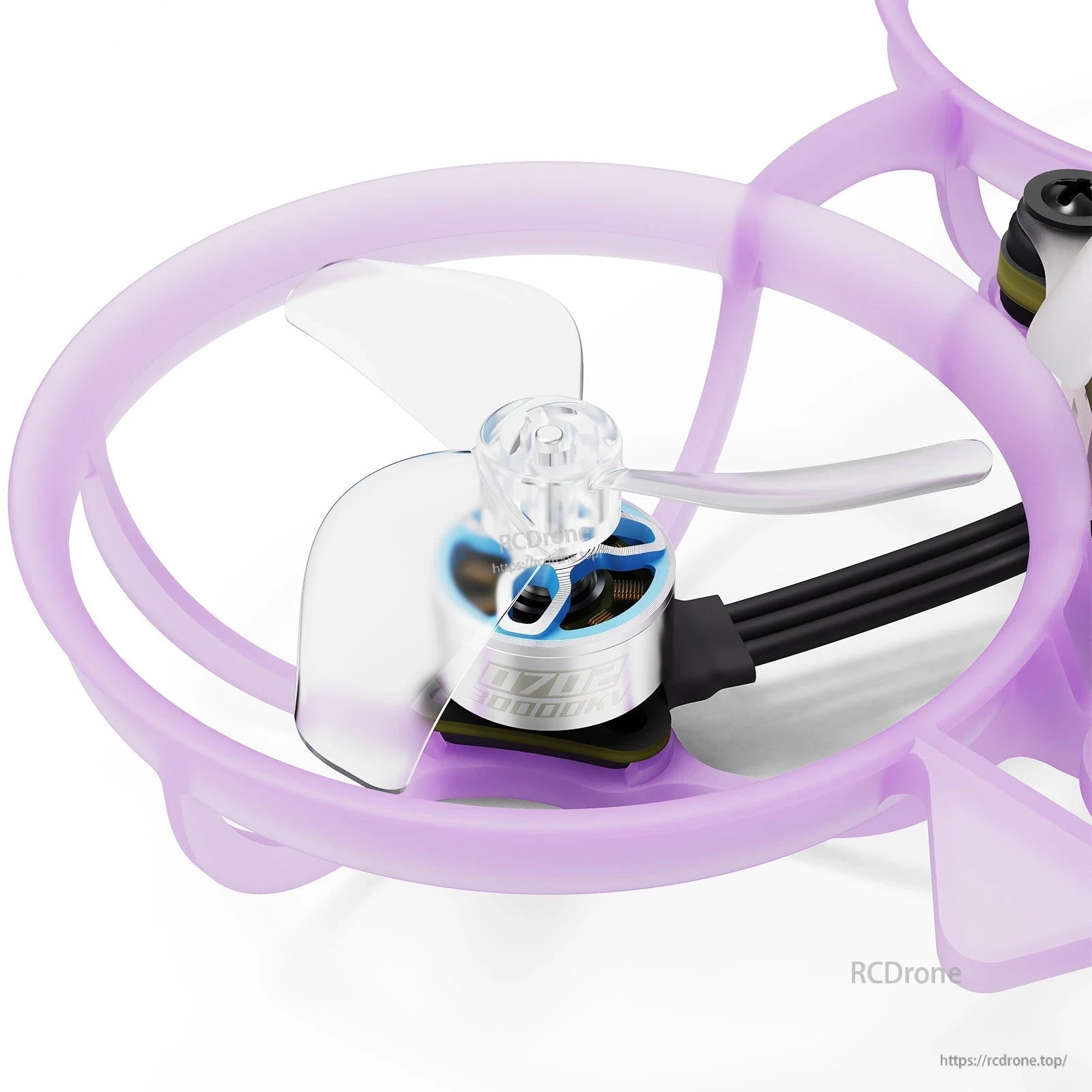 Close-up of a BETAFPV micro whoop drone motor with clear propeller inside a translucent purple duct