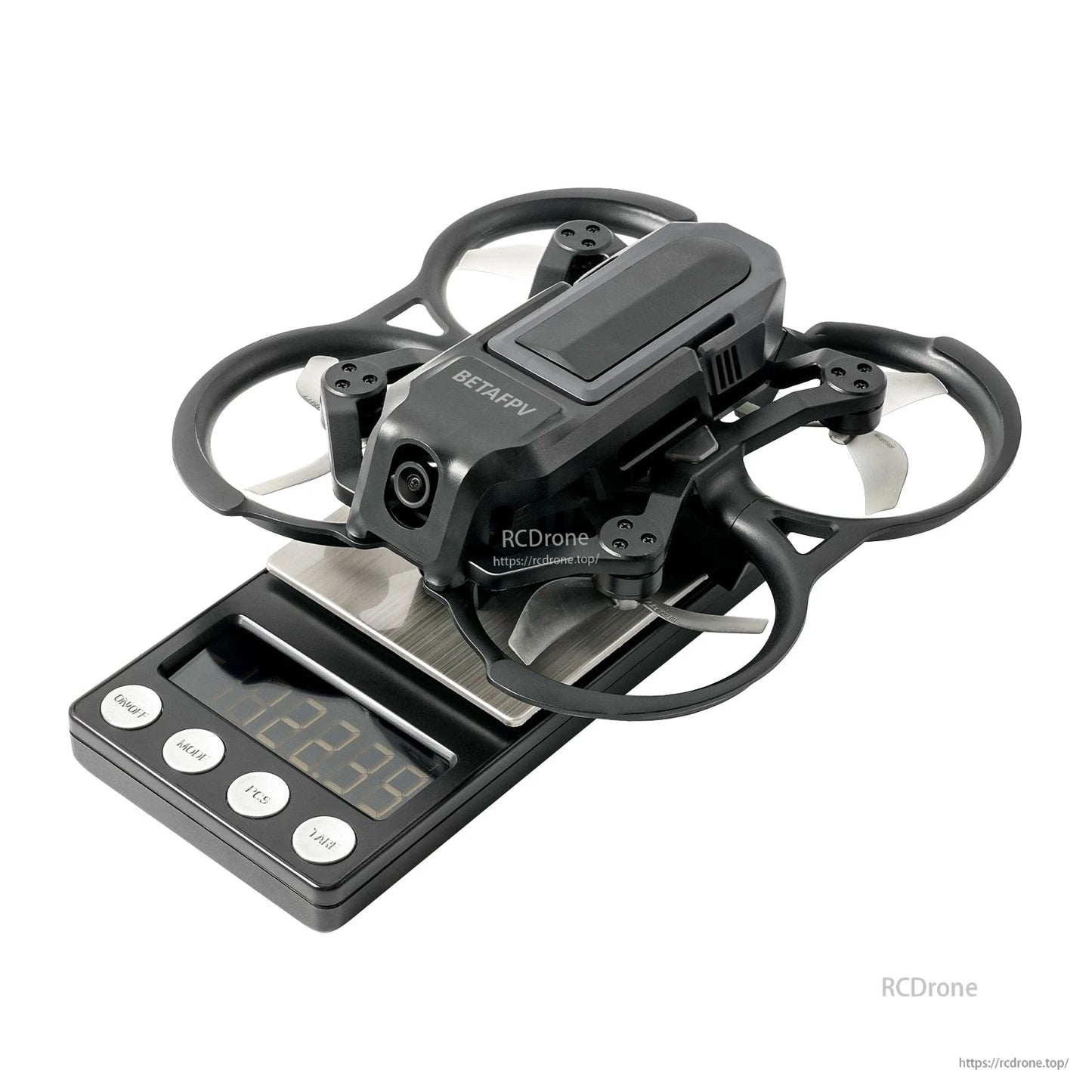 BETAFPV ducted FPV drone with prop guards and front camera sitting on a digital scale