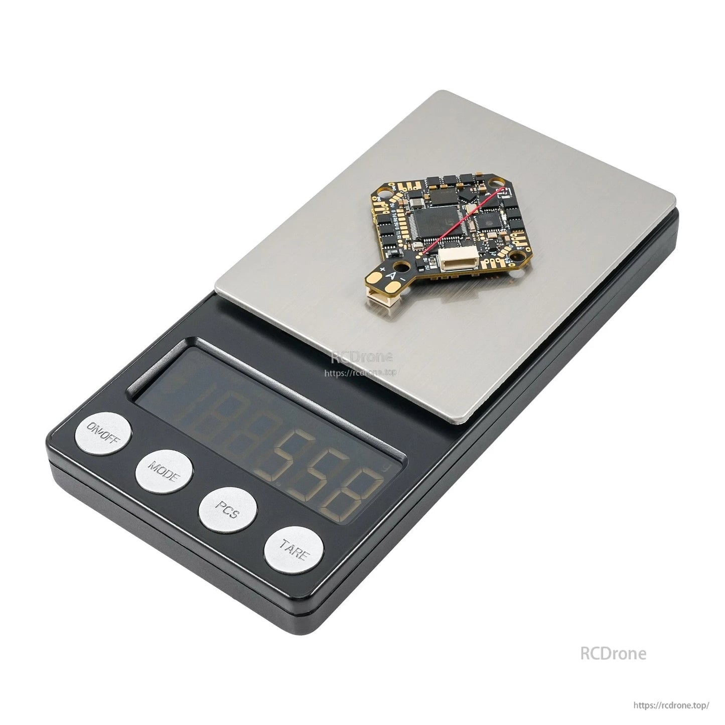 Flight controller board on a digital scale with the display reading 6.60