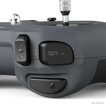 Right-side controls close-up (dark color) showing SA/SE switches and side button layout