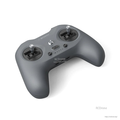 Top angled view of LiteRadio 4 showing both sticks, center buttons, and compact gamepad-style body
