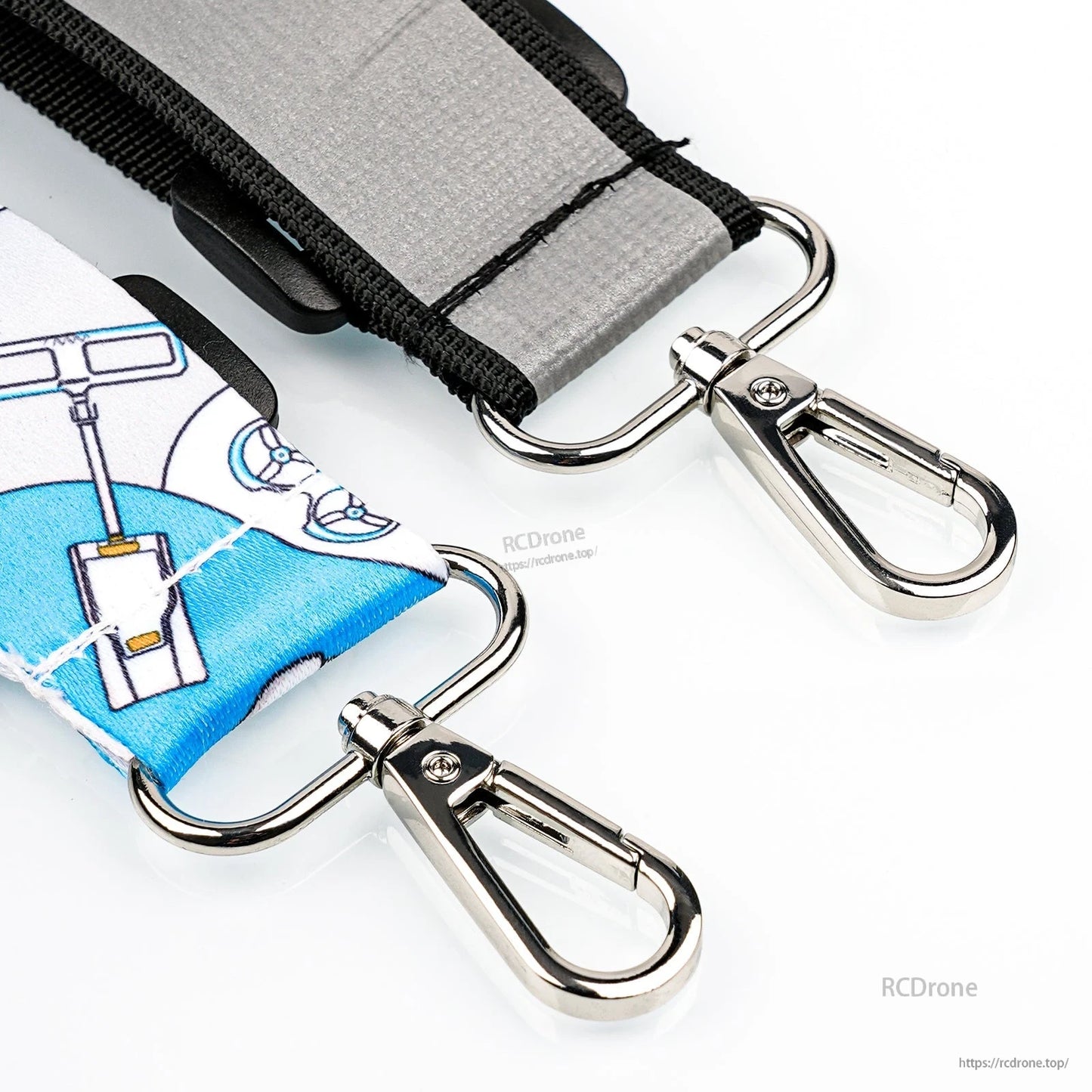 Close-up of metal swivel snap hooks and D-rings on the LiteRadio neck strap ends