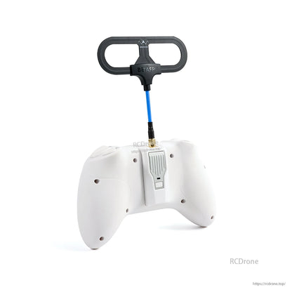 Rear view of white RC transmitter with loop antenna mounted on top via SMA connector, straight-on angle