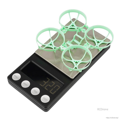 Light green Meteor65 Pro frame on digital scale showing 3.20g weight
