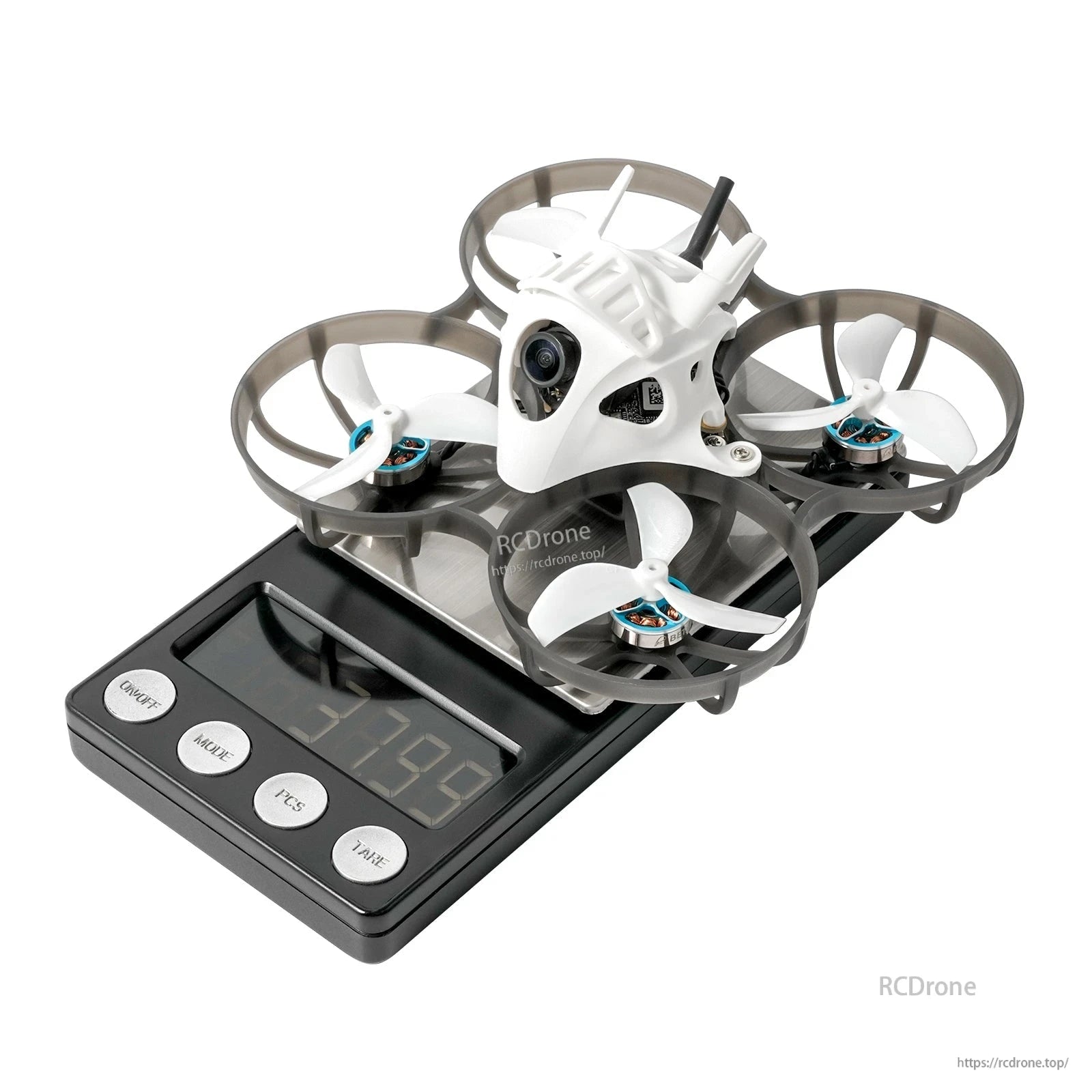 BETAFPV ducted micro FPV quadcopter with white canopy and front camera sitting on a digital scale